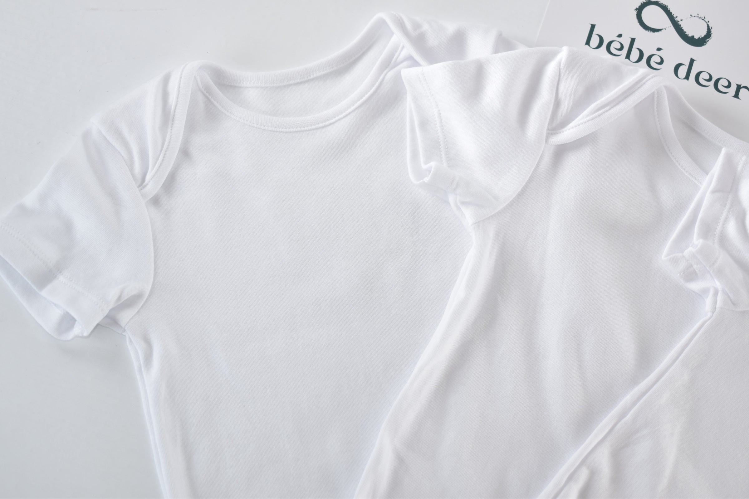 Set of 3 white bodysuits