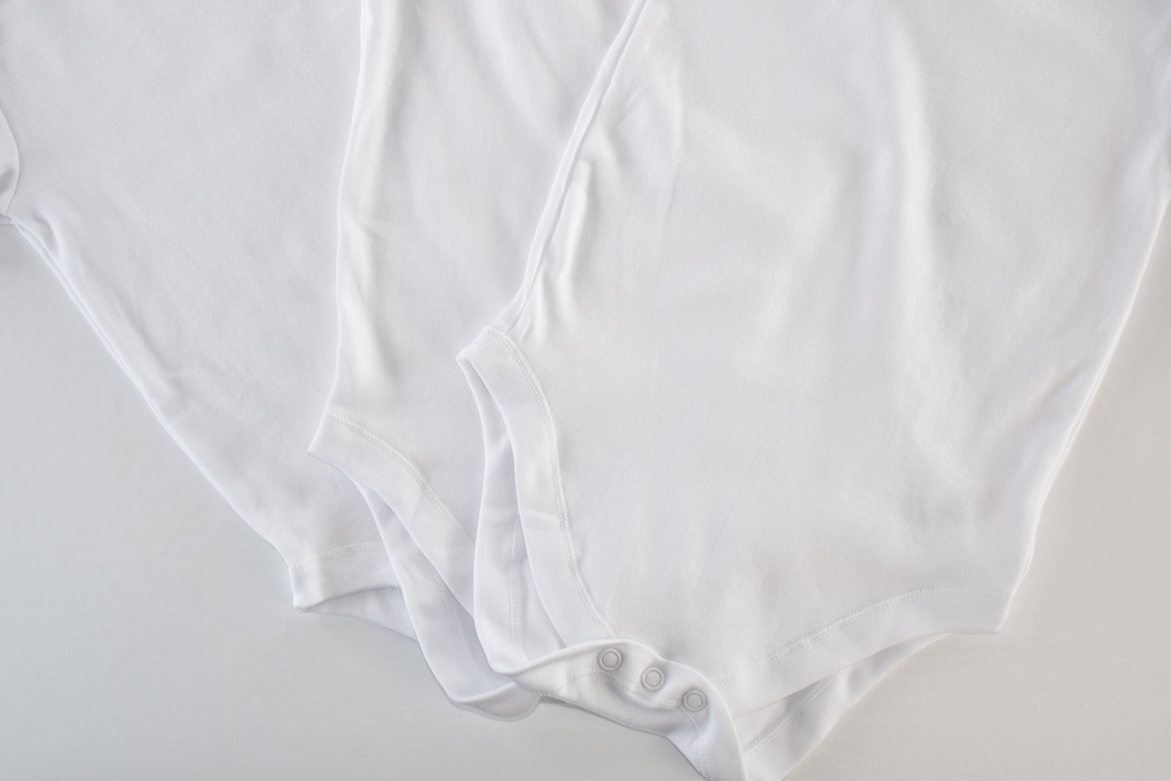 Set of 3 white bodysuits