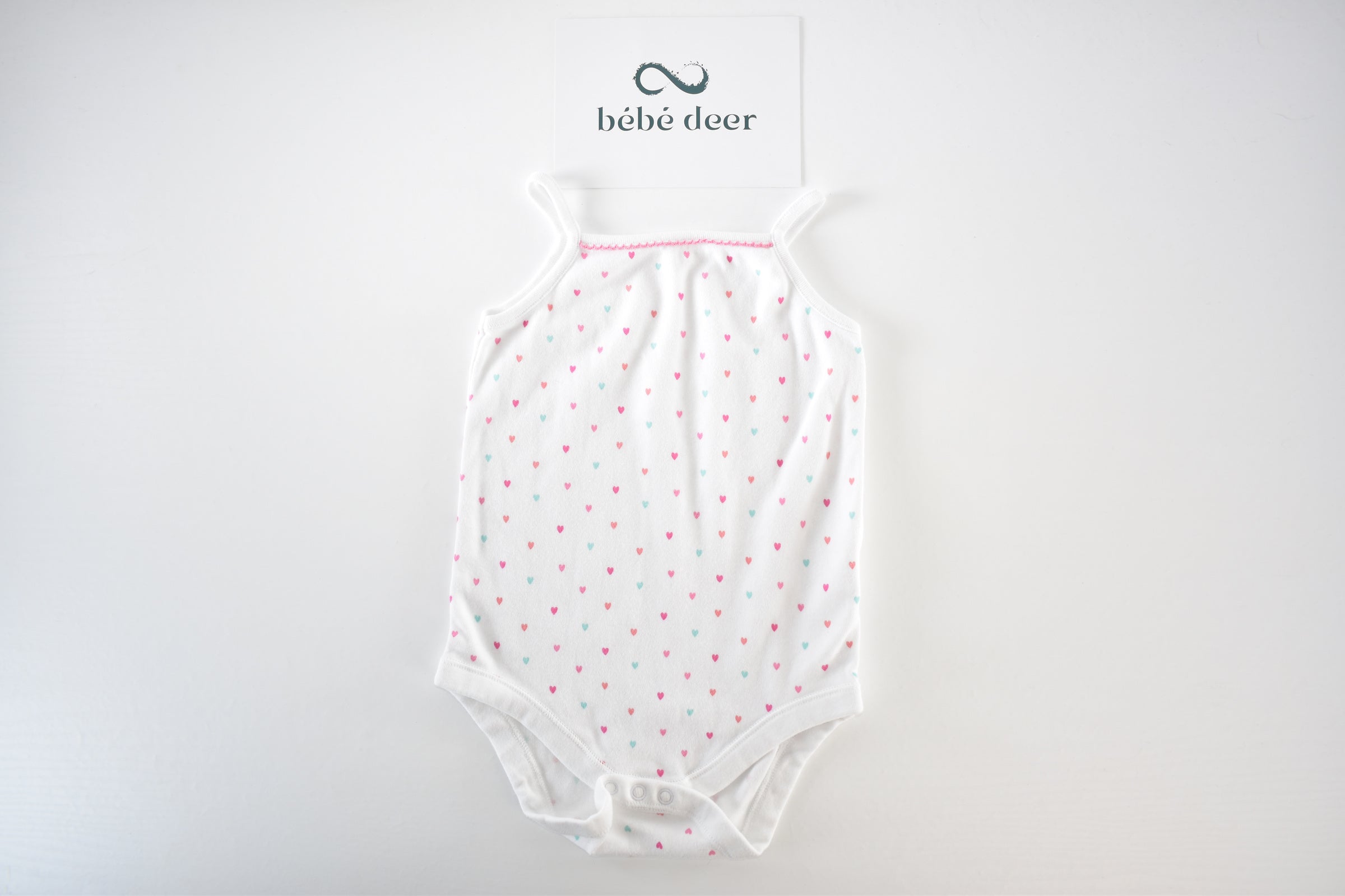 White heart print sleeveless bodysuit