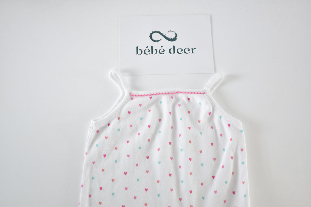 White heart print sleeveless bodysuit