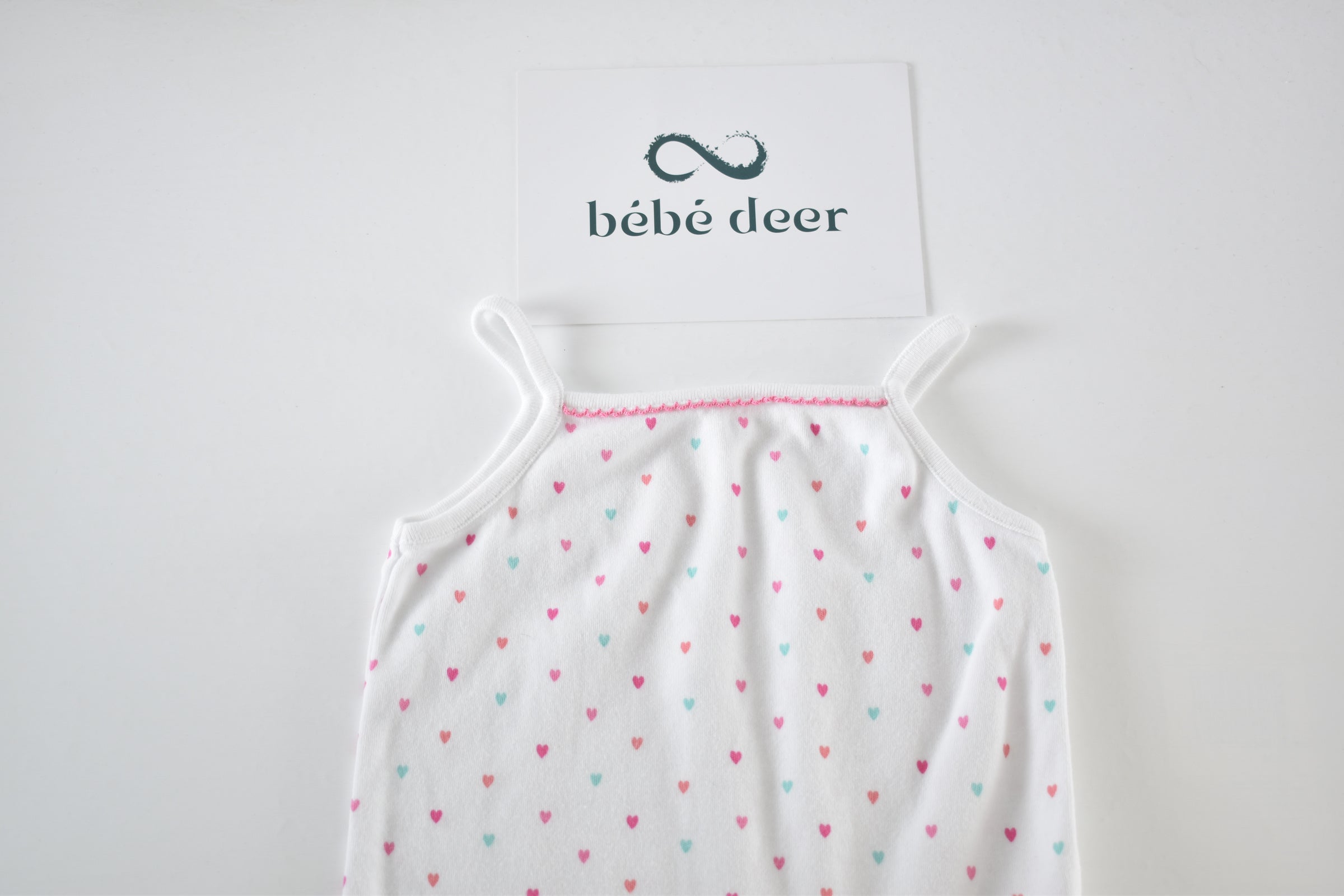 White heart print sleeveless bodysuit