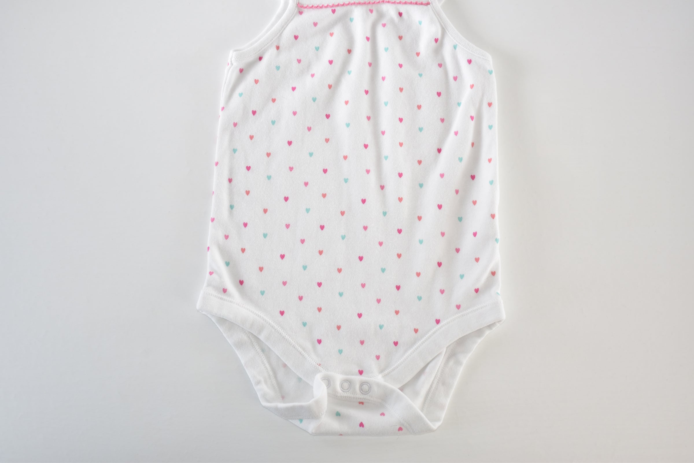 White heart print sleeveless bodysuit