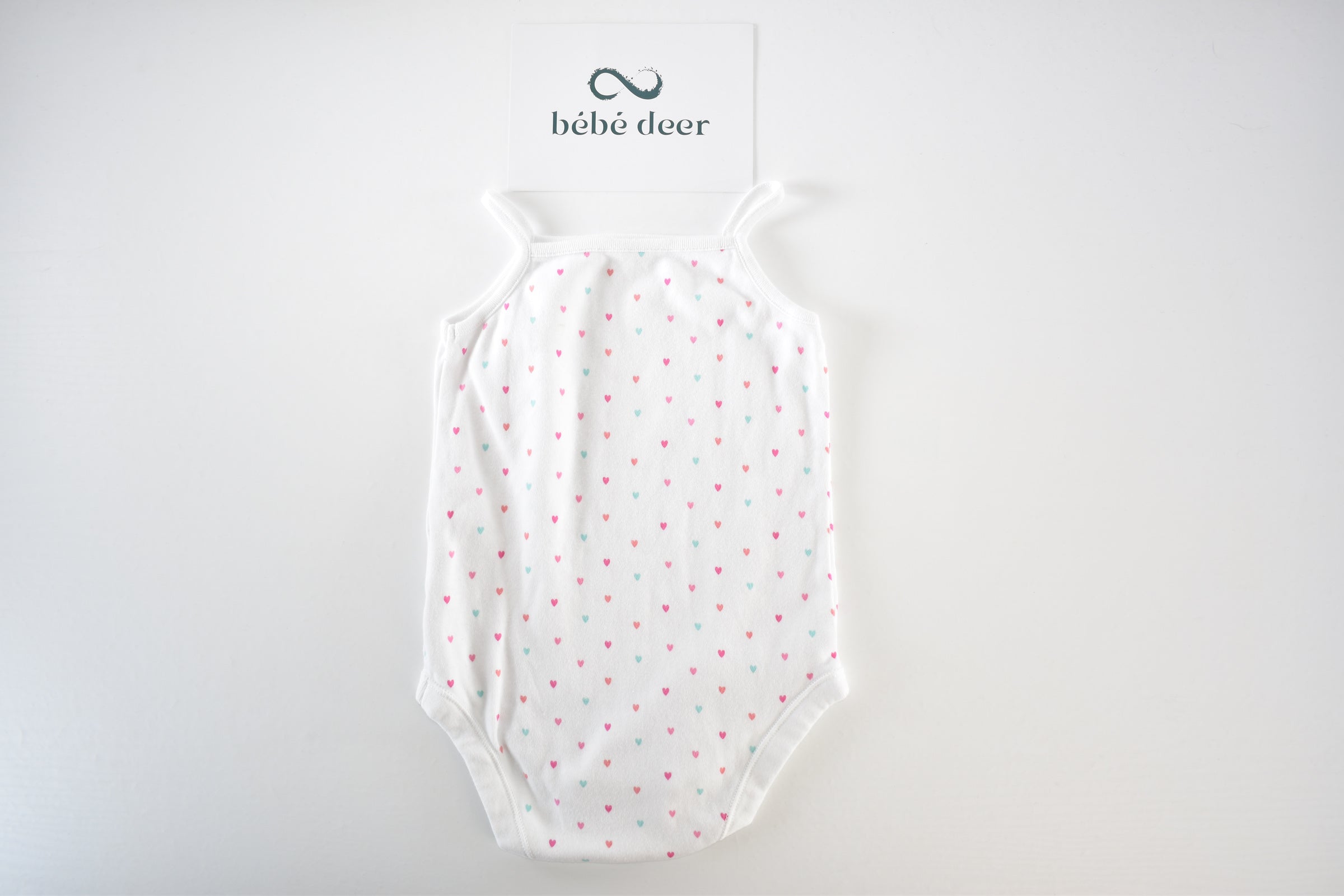 White heart print sleeveless bodysuit