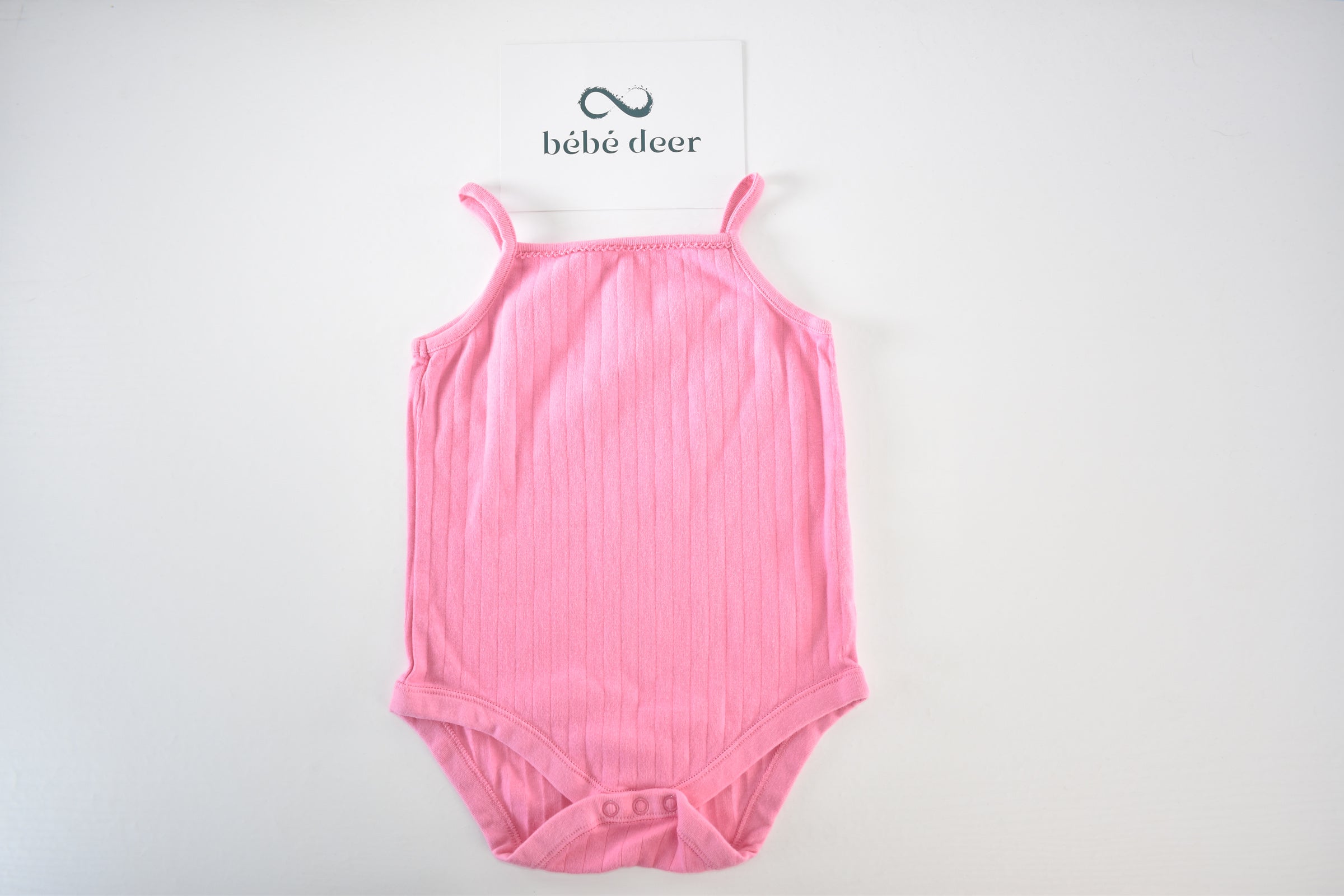 Pink ribbed sleeveless bodysuit