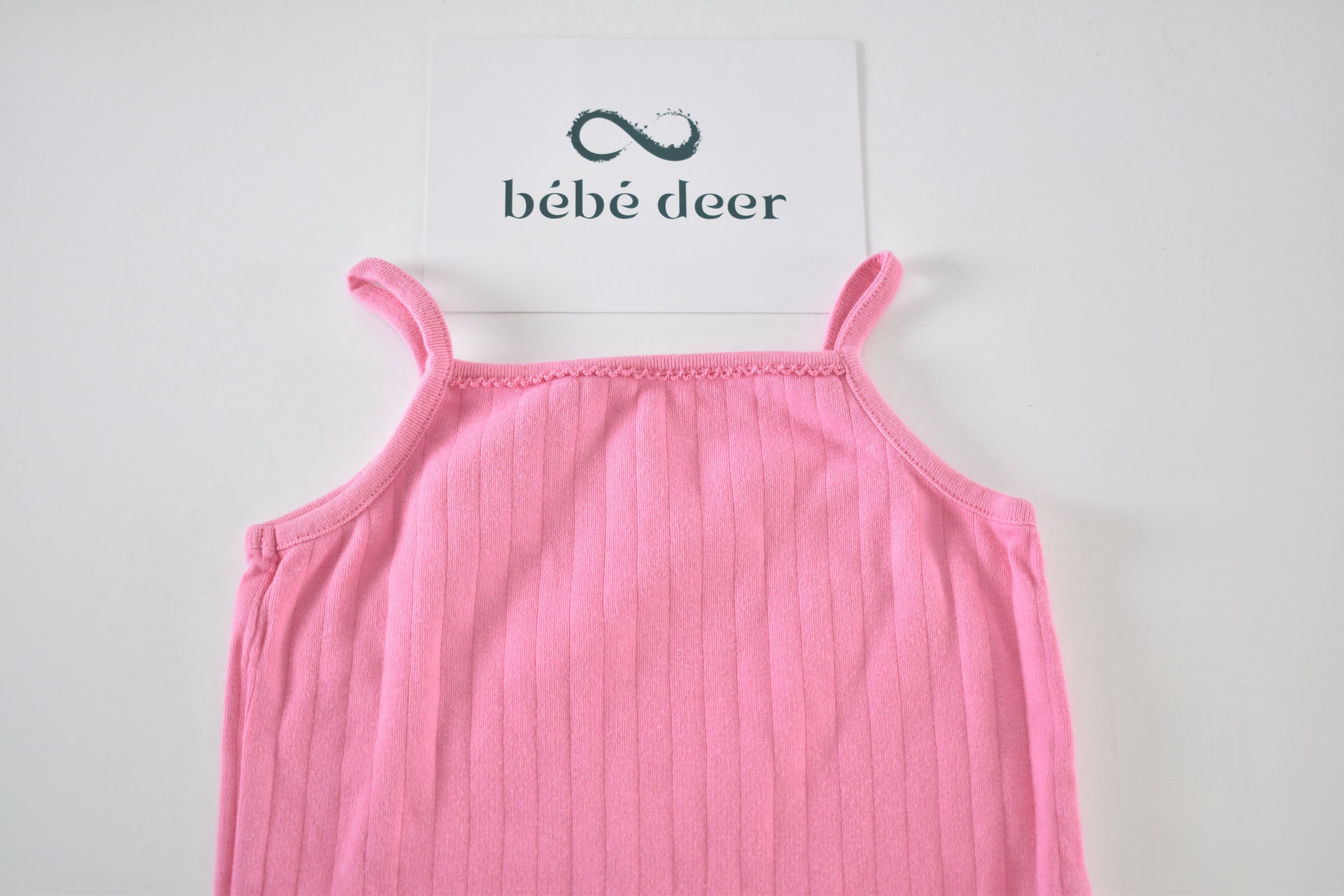 Pink ribbed sleeveless bodysuit