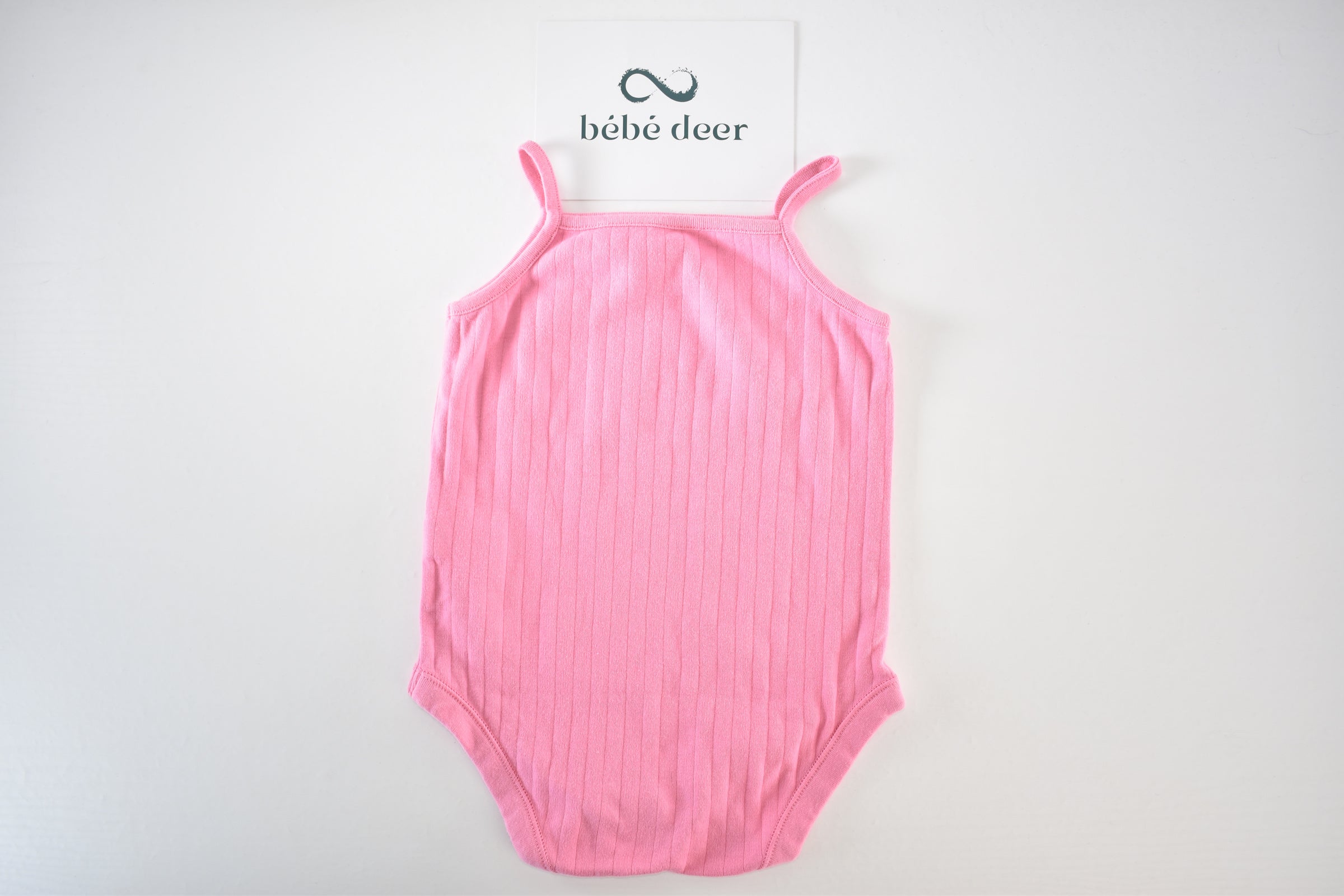 Pink ribbed sleeveless bodysuit