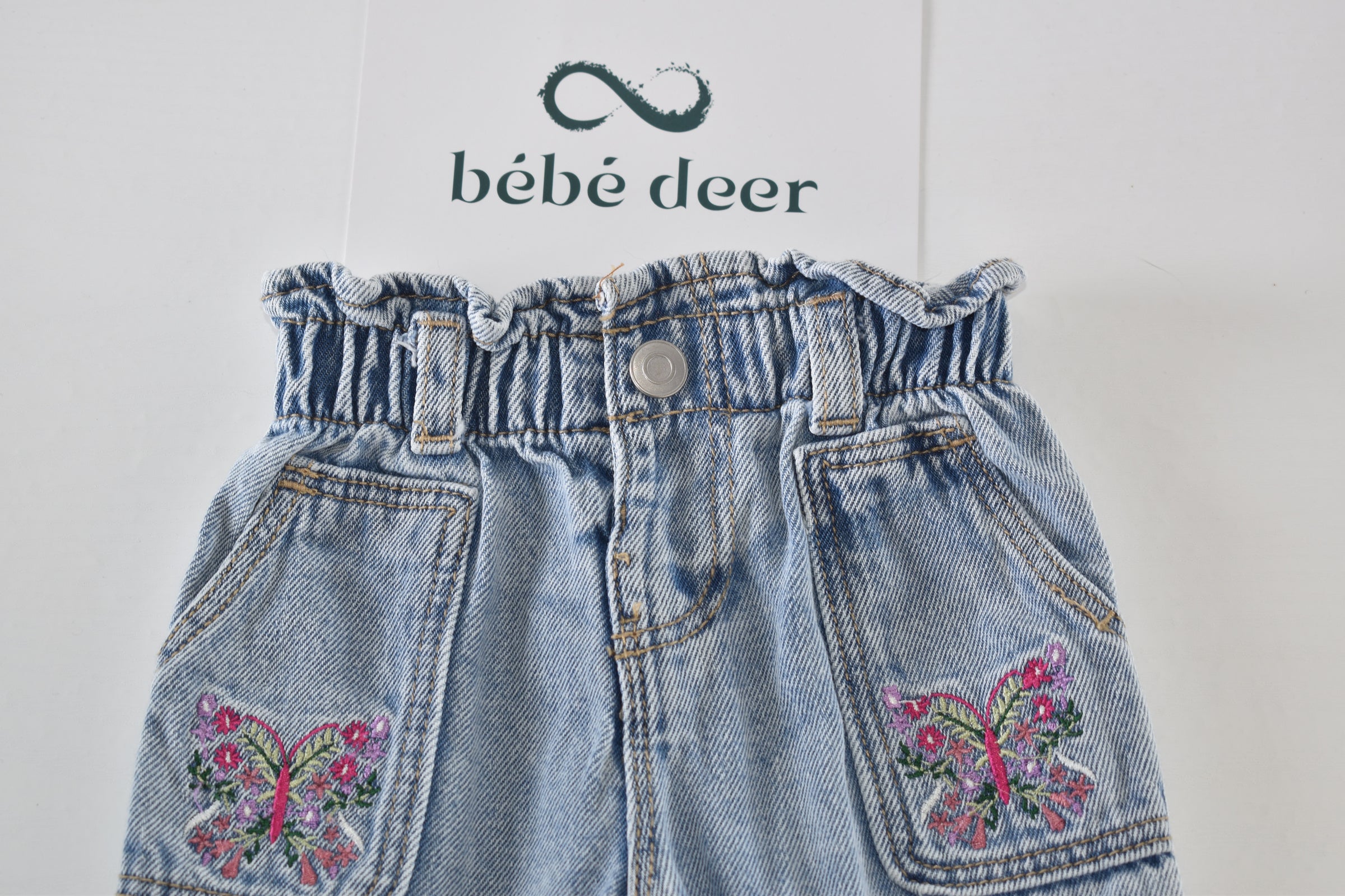 Light wash butterfly embroidered jeans