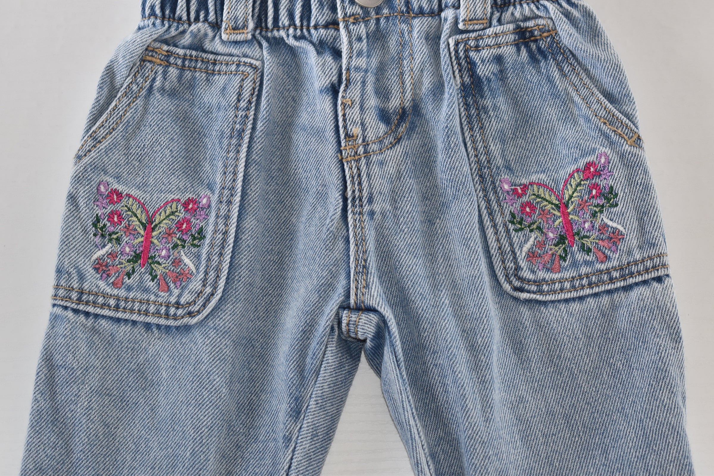 Light wash butterfly embroidered jeans