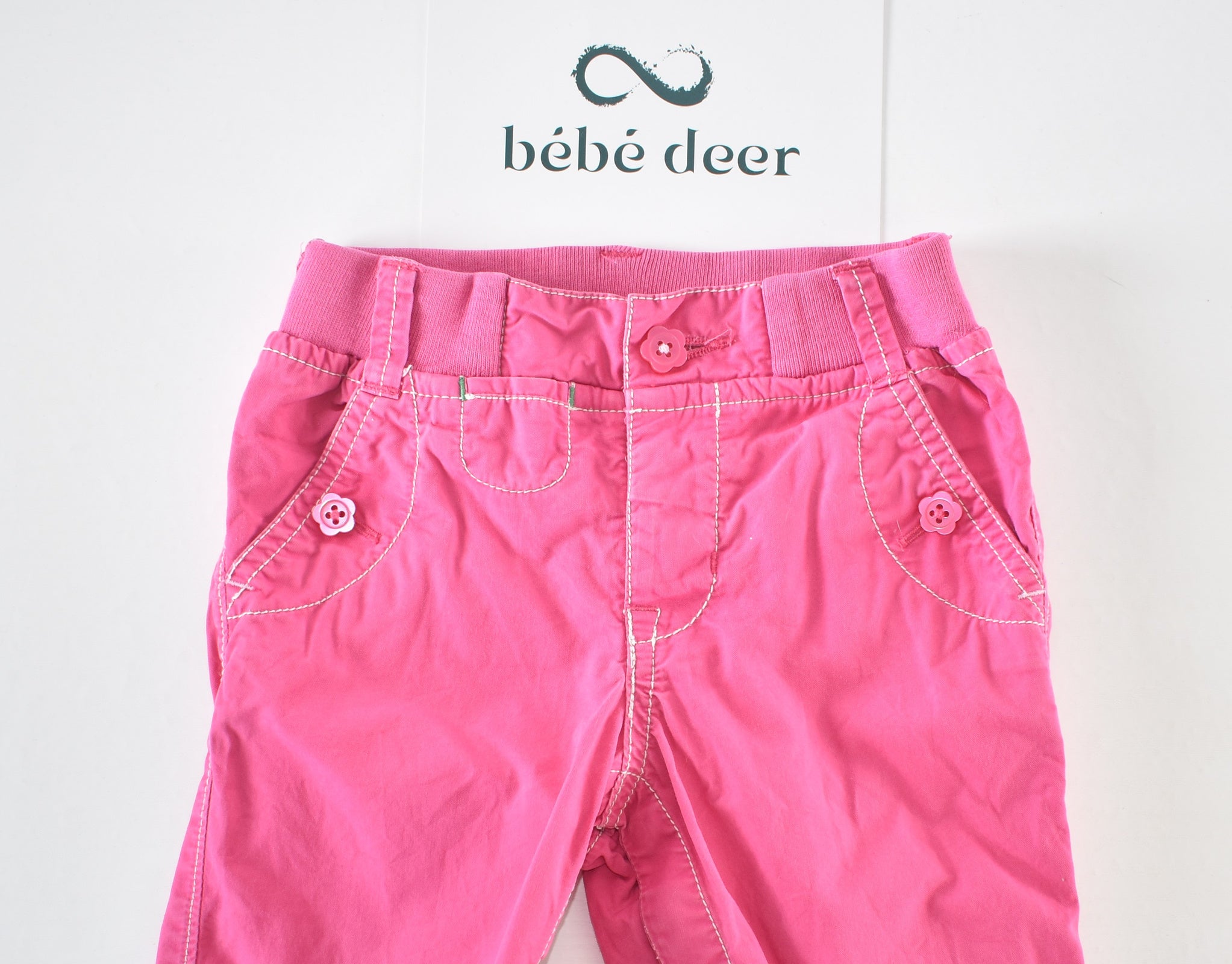 Convertible pink trousers with adjustable legs