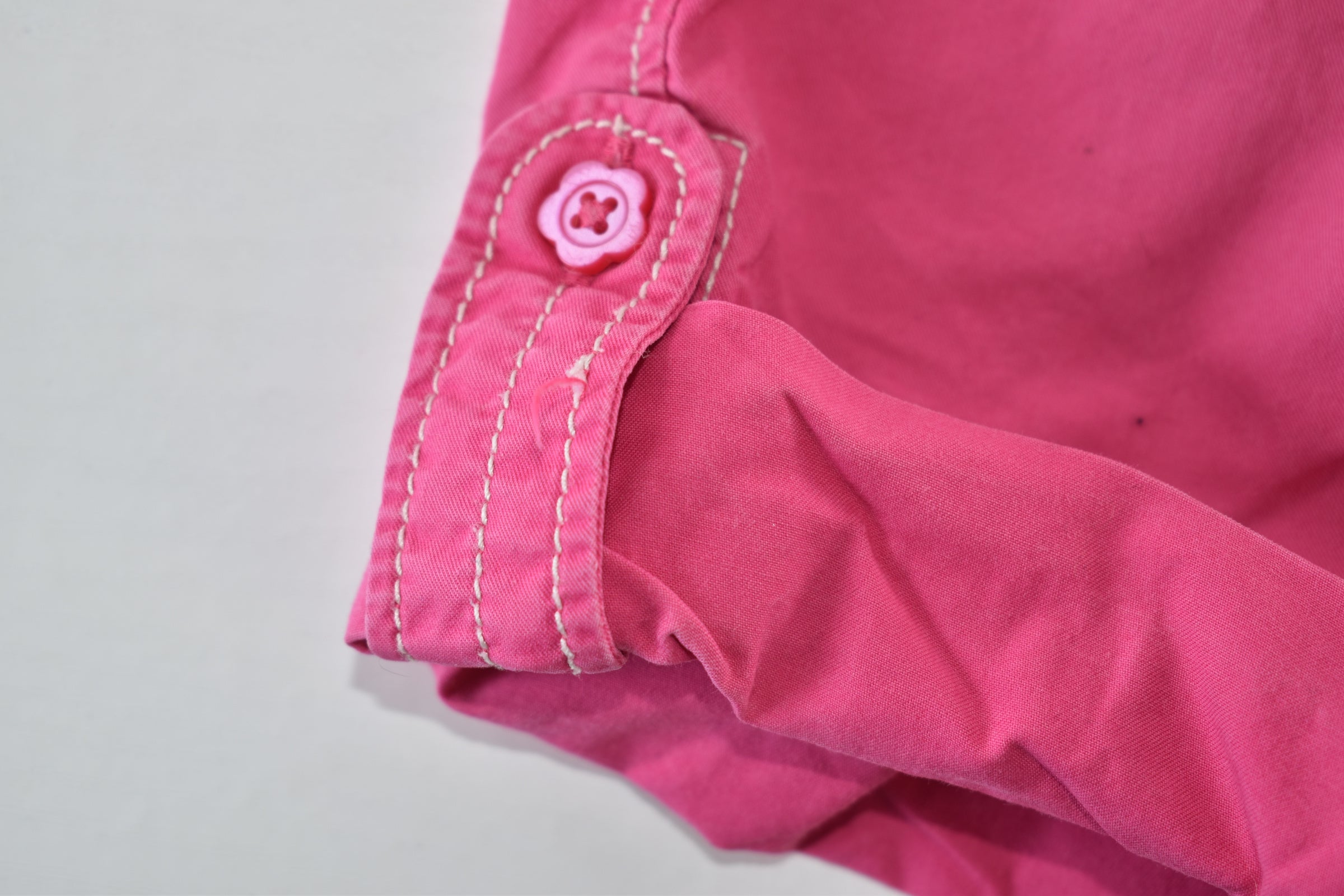 Convertible pink trousers with adjustable legs