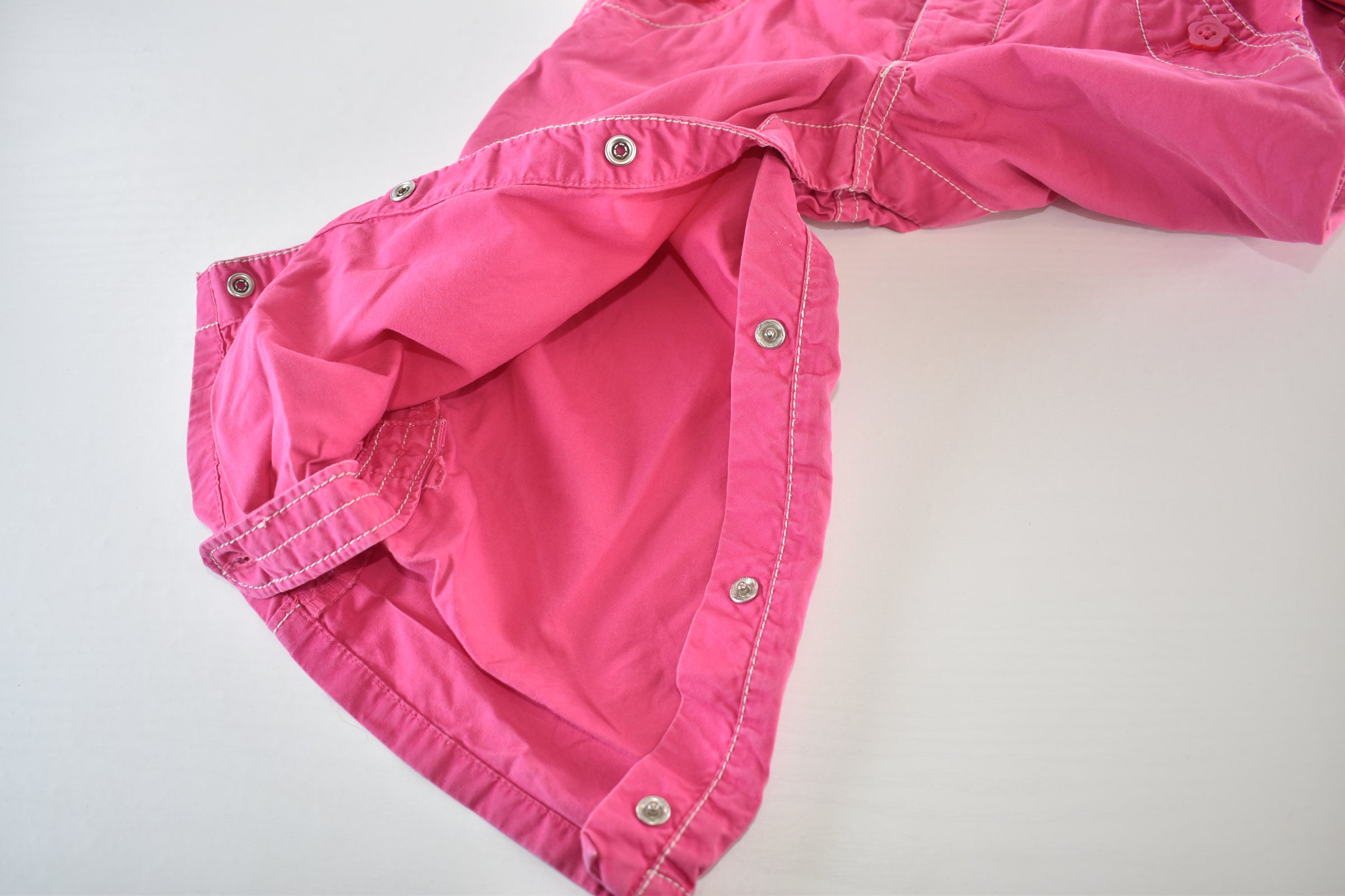 Convertible pink trousers with adjustable legs