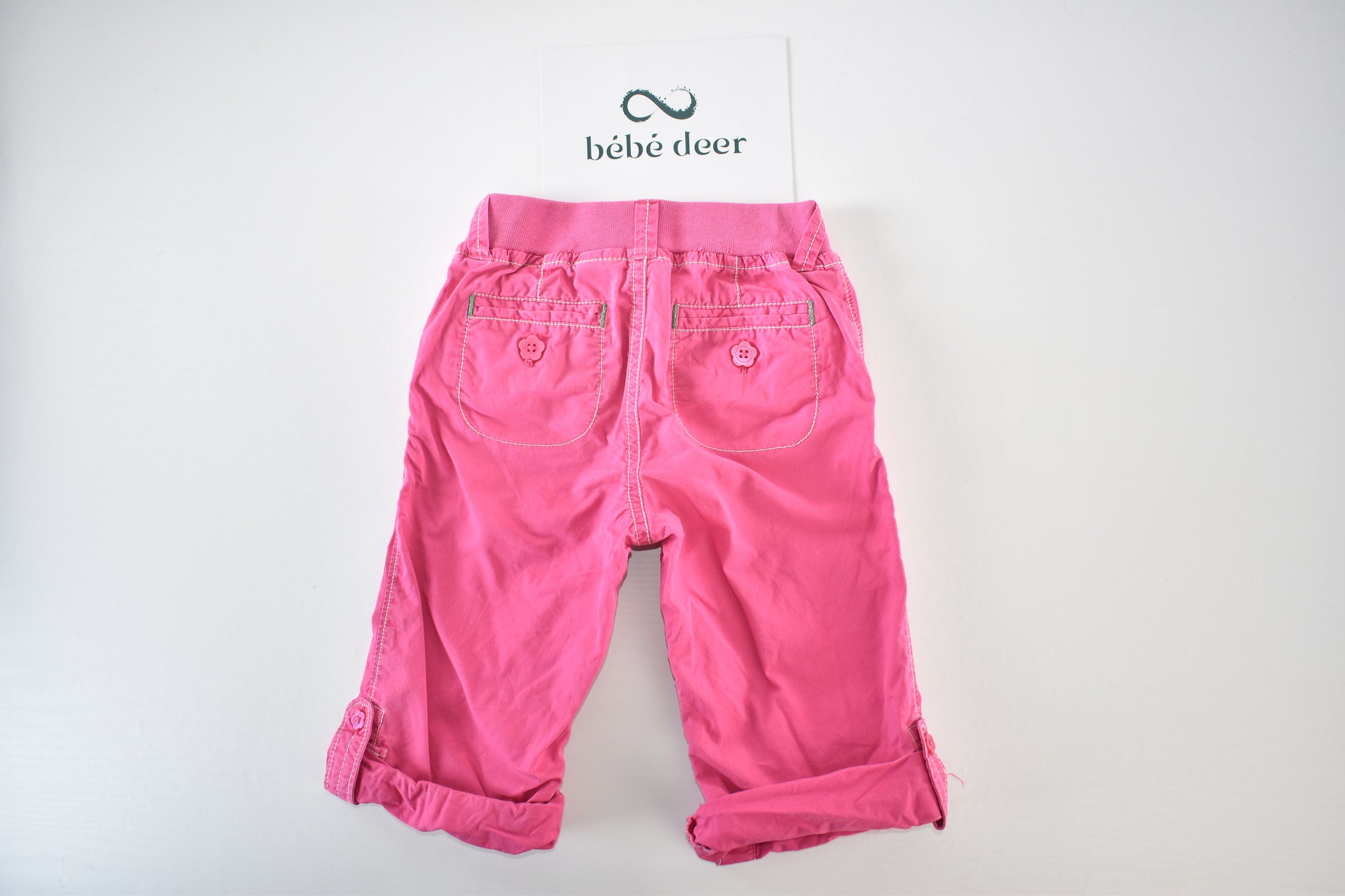 Convertible pink trousers with adjustable legs