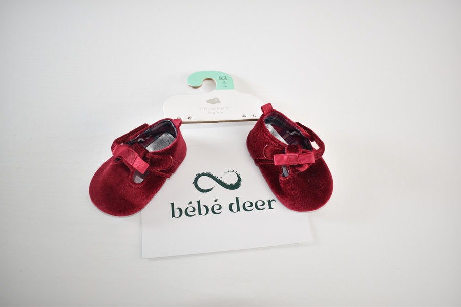 Red velvet shoes with bow detail