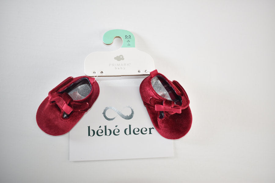 Red velvet shoes with bow detail