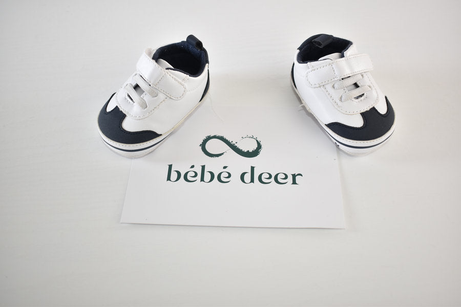 White and navy shoes with velcro fastening