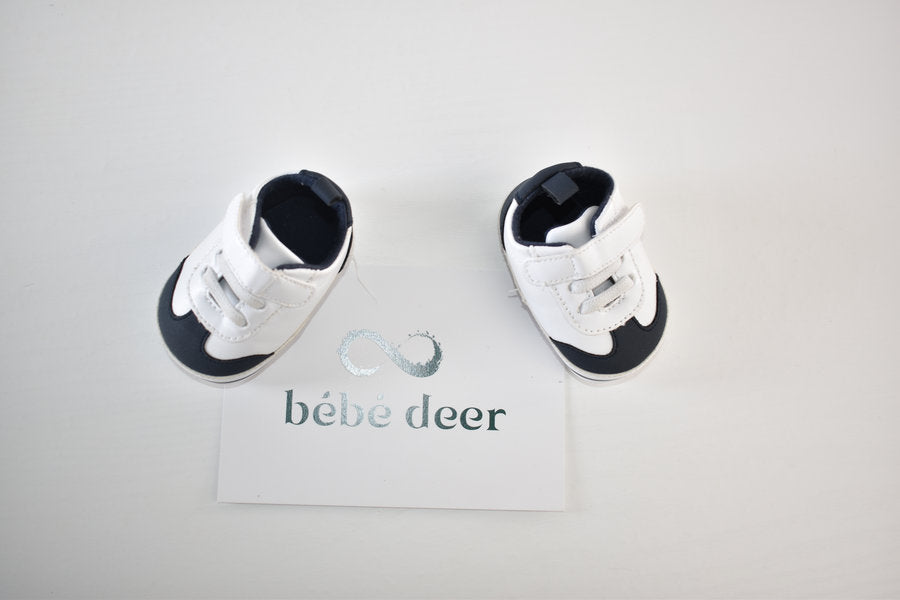 White and navy shoes with velcro fastening