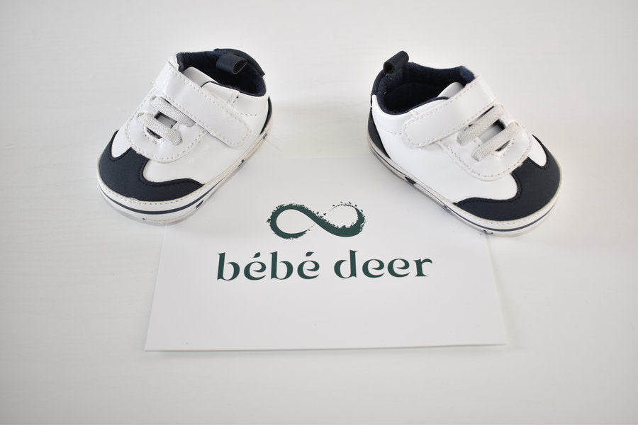 White and navy shoes with velcro fastening