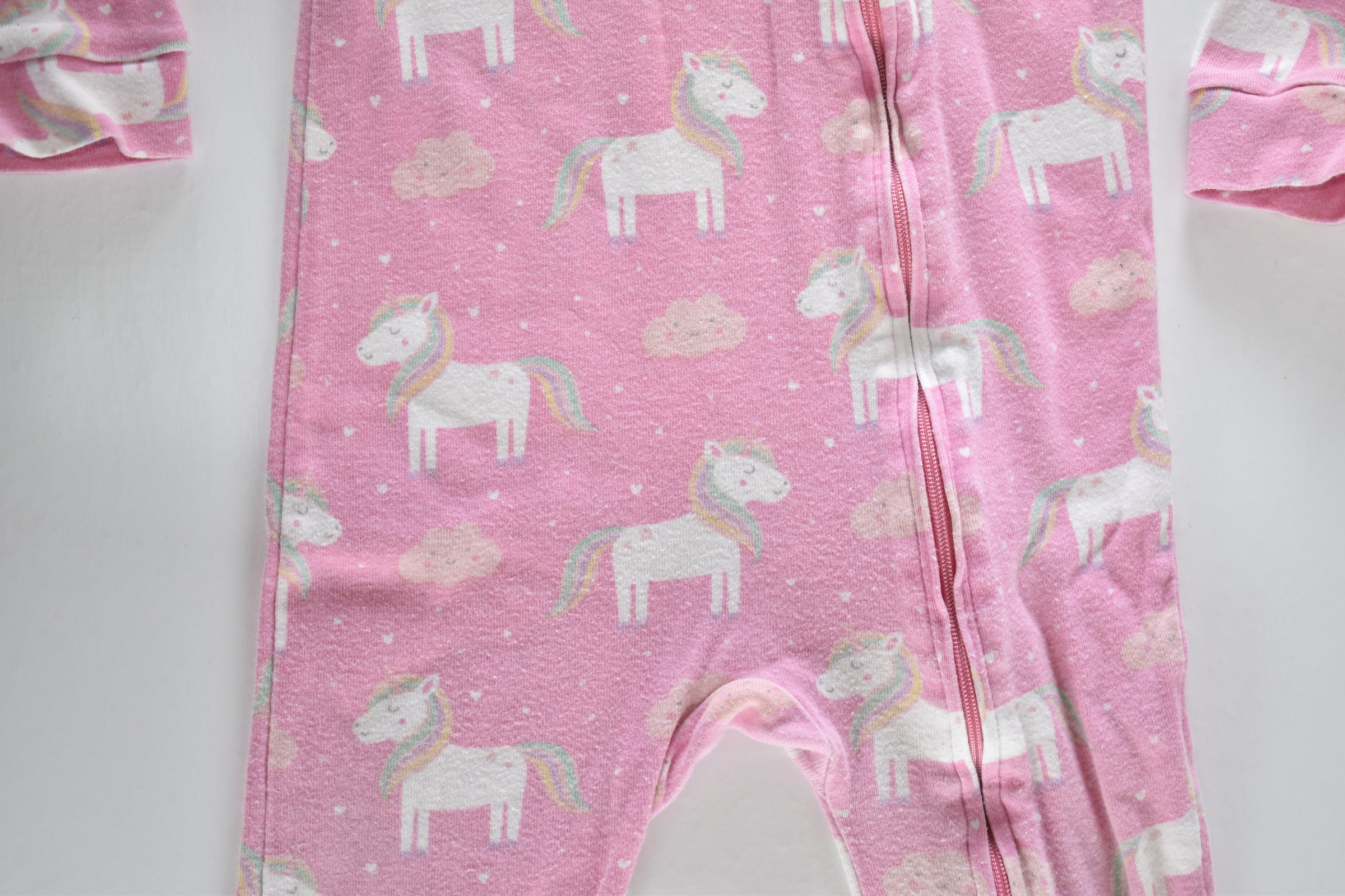 Pink unicorn zip sleepsuit