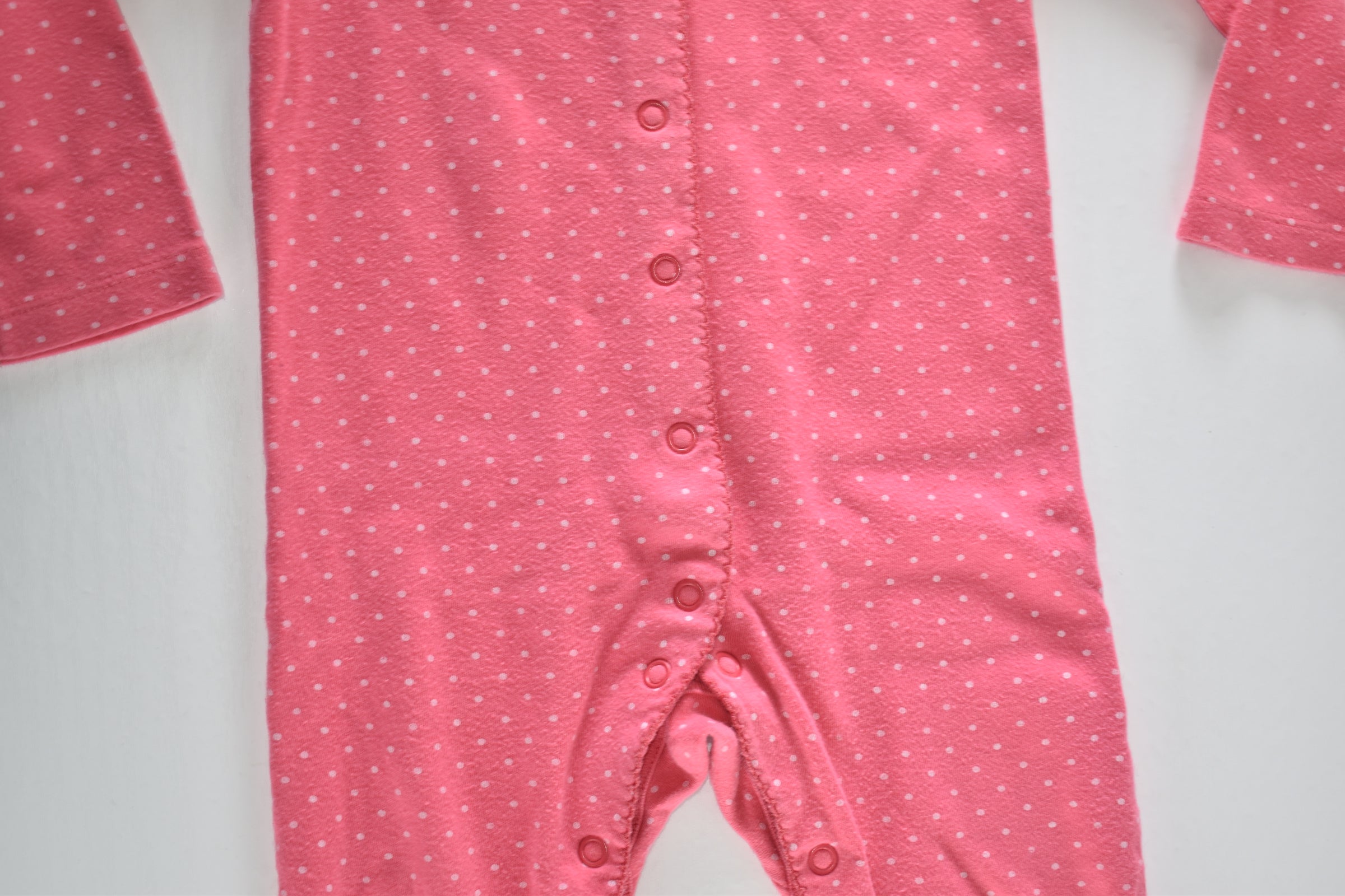 Pink polka dot sleepsuit