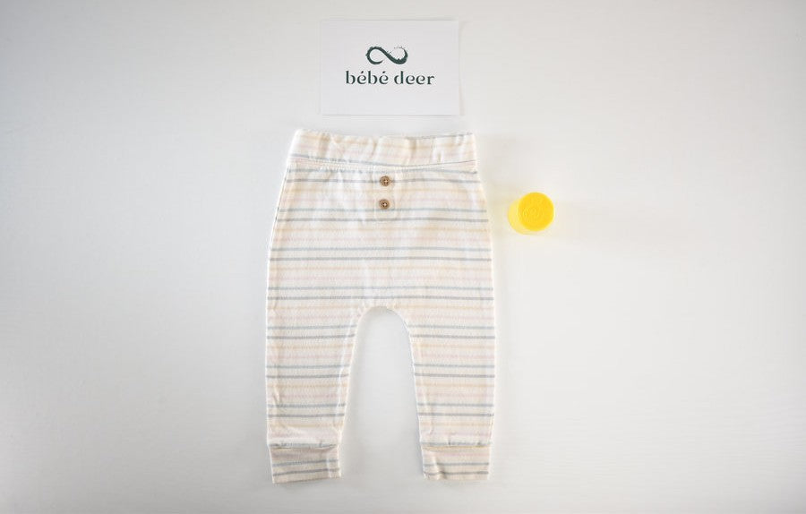 Cream trousers with pastel stripe pattern