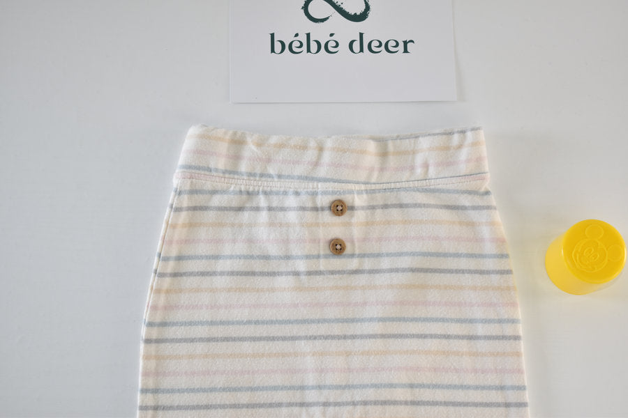 Cream trousers with pastel stripe pattern