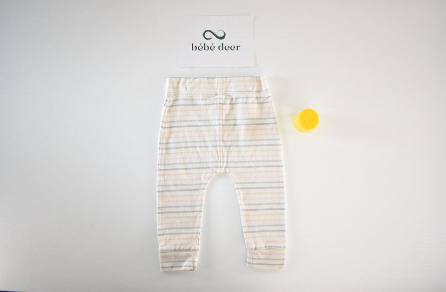 Cream trousers with pastel stripe pattern