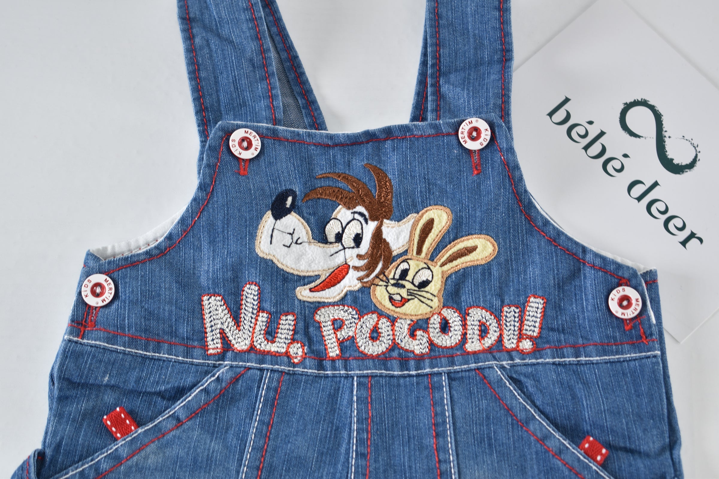 Denim dungarees with embroidered characters