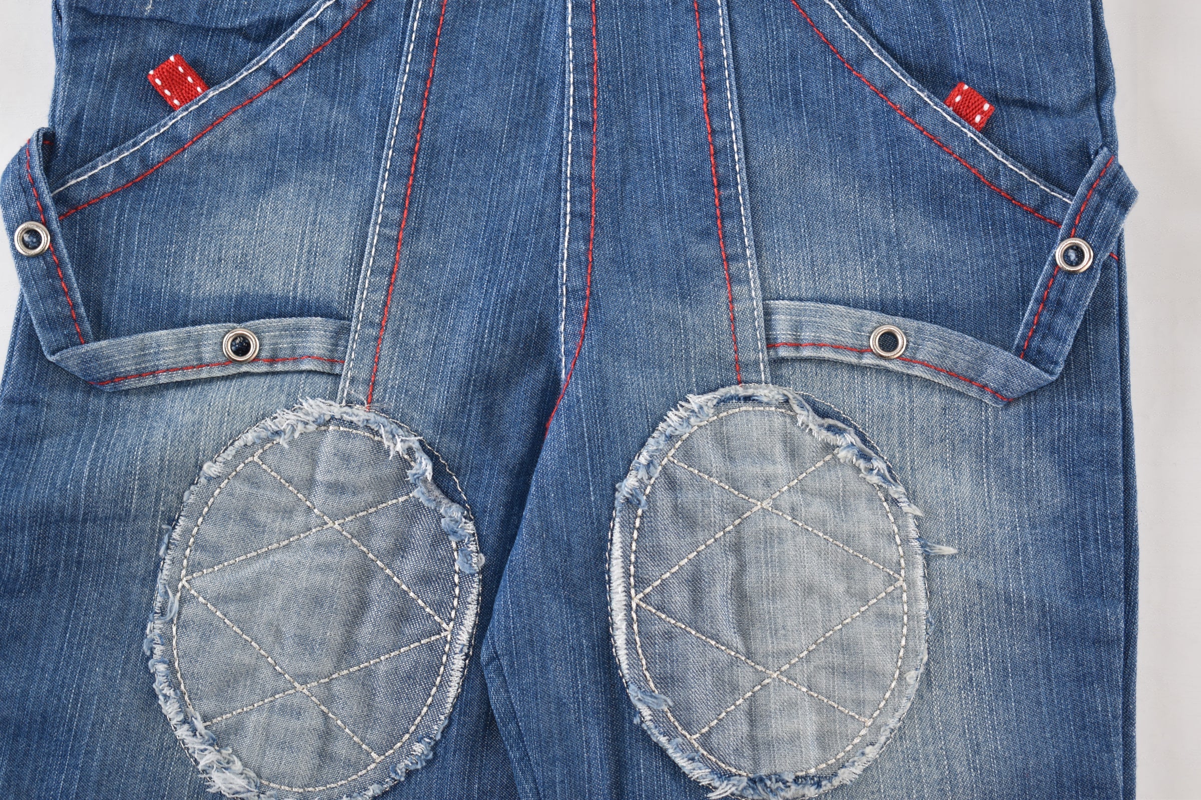 Denim dungarees with embroidered characters