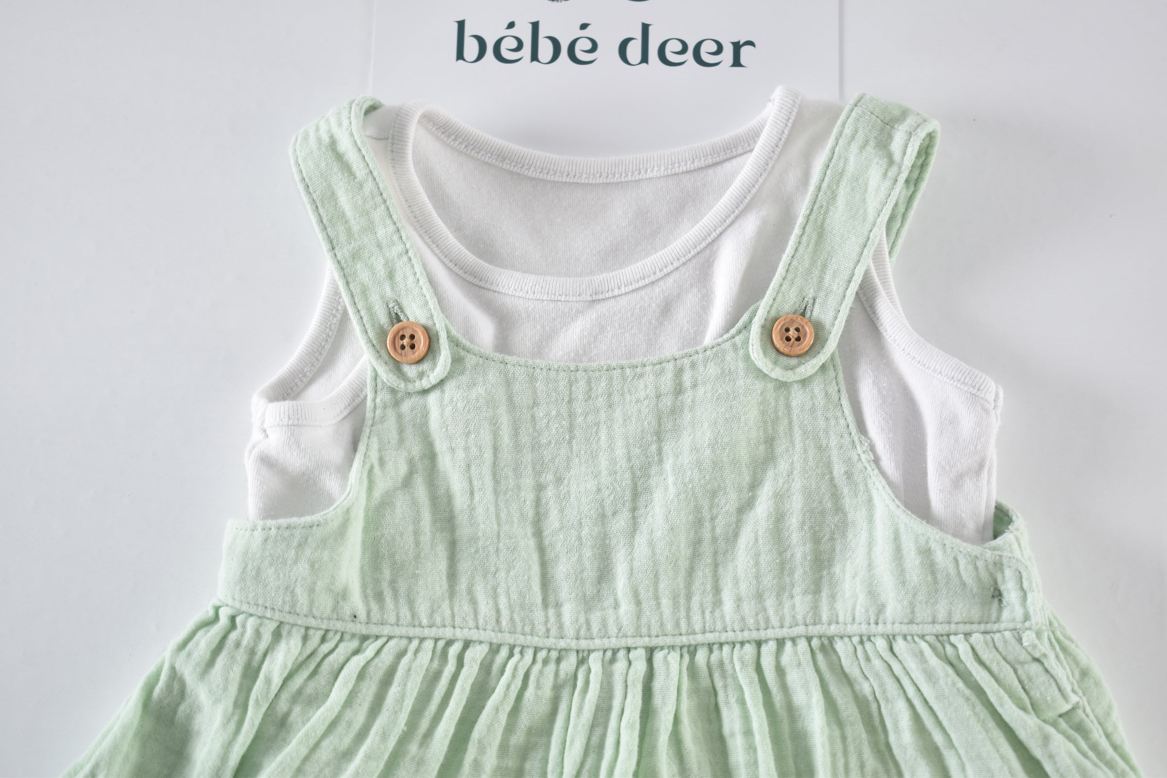 Pale green muslin dress and bodysuit set