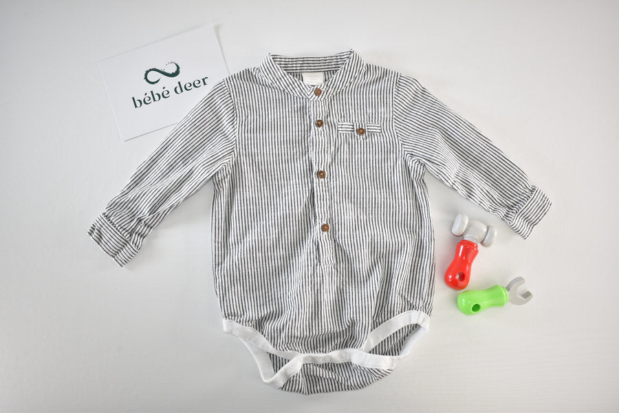 Black and white striped long-sleeve shirt-style bodysuit