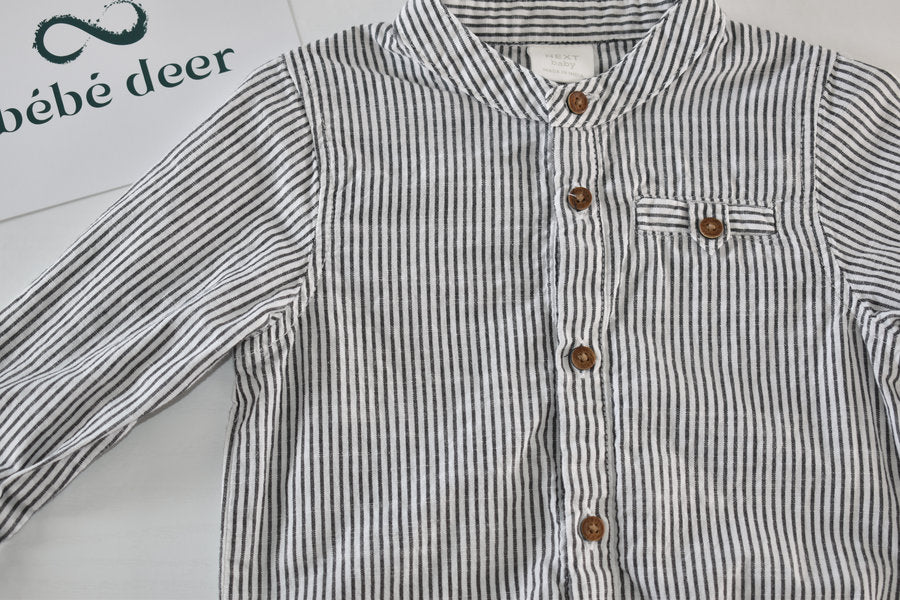 Black and white striped long-sleeve shirt-style bodysuit