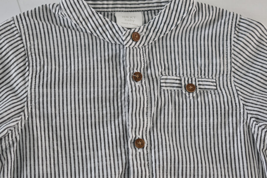 Black and white striped long-sleeve shirt-style bodysuit