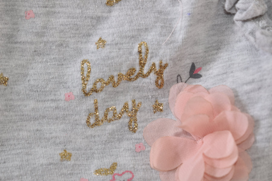 Peppa Pig top with floral details and "Lovely day" slogan