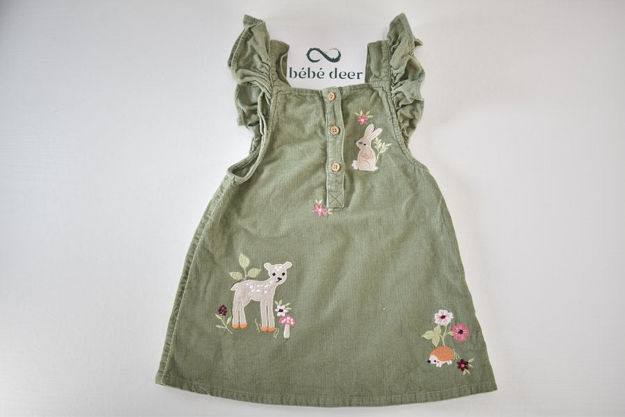 Green cord dress with woodland animal embroidery