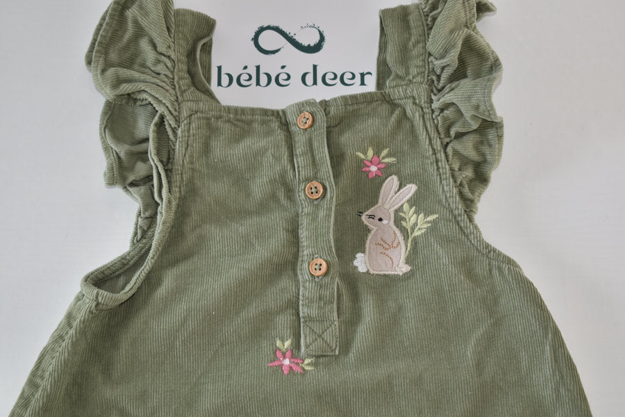 Green cord dress with woodland animal embroidery