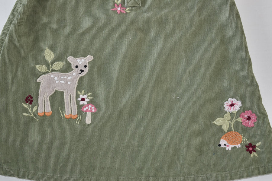 Green cord dress with woodland animal embroidery