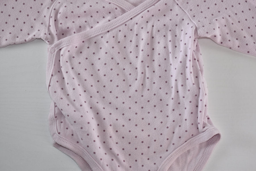 Pink wrap style polka dot bodysuit