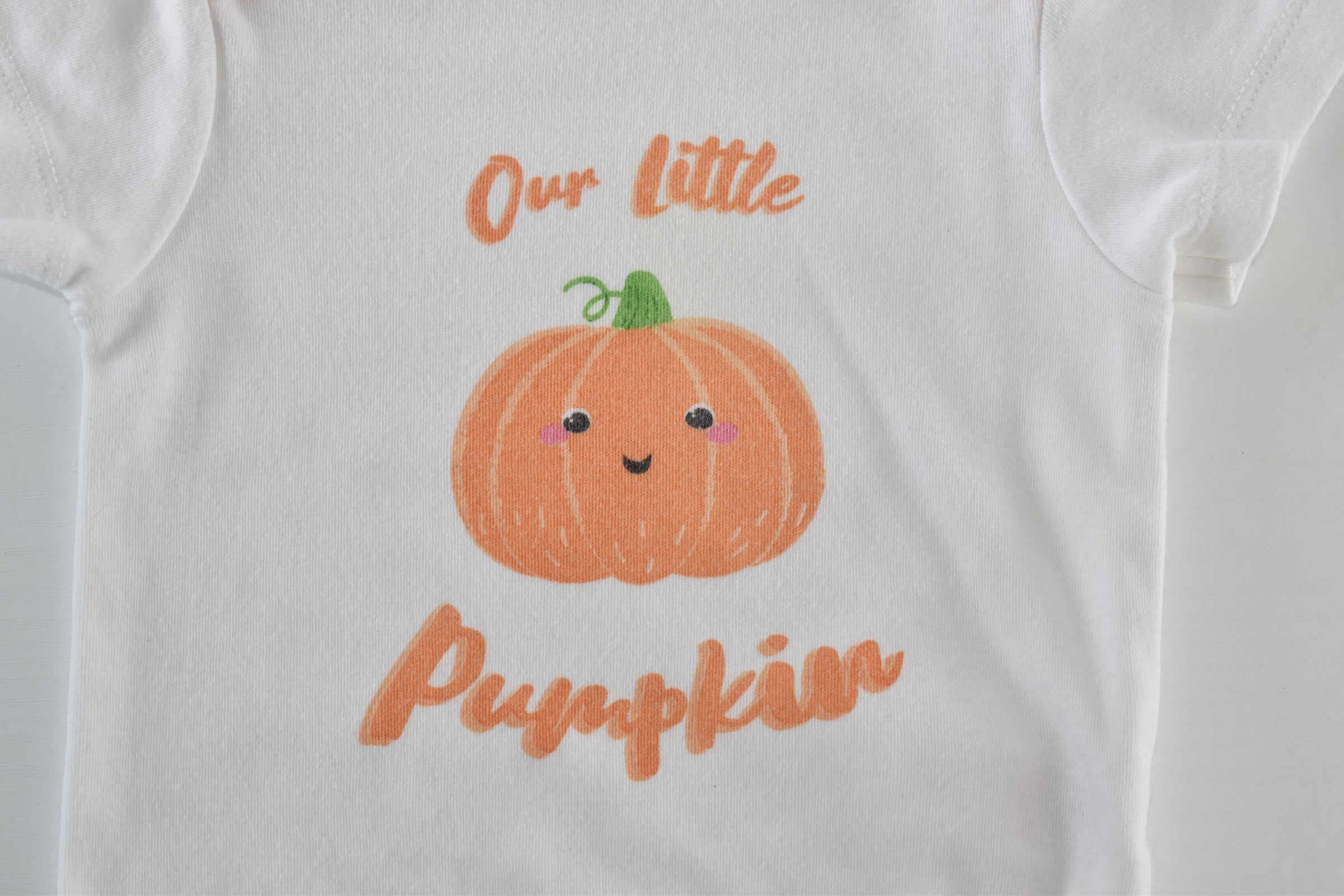Halloween "Our Little Pumpkin" bodysuit with pumpkin print