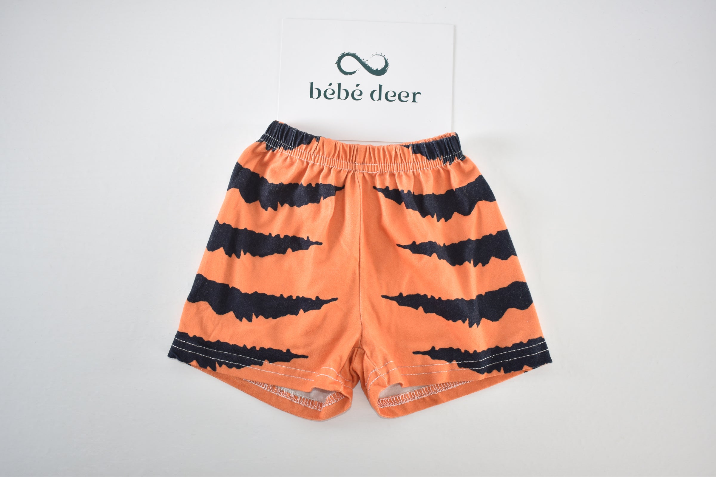 Halloween orange and black spooky stripe shorts