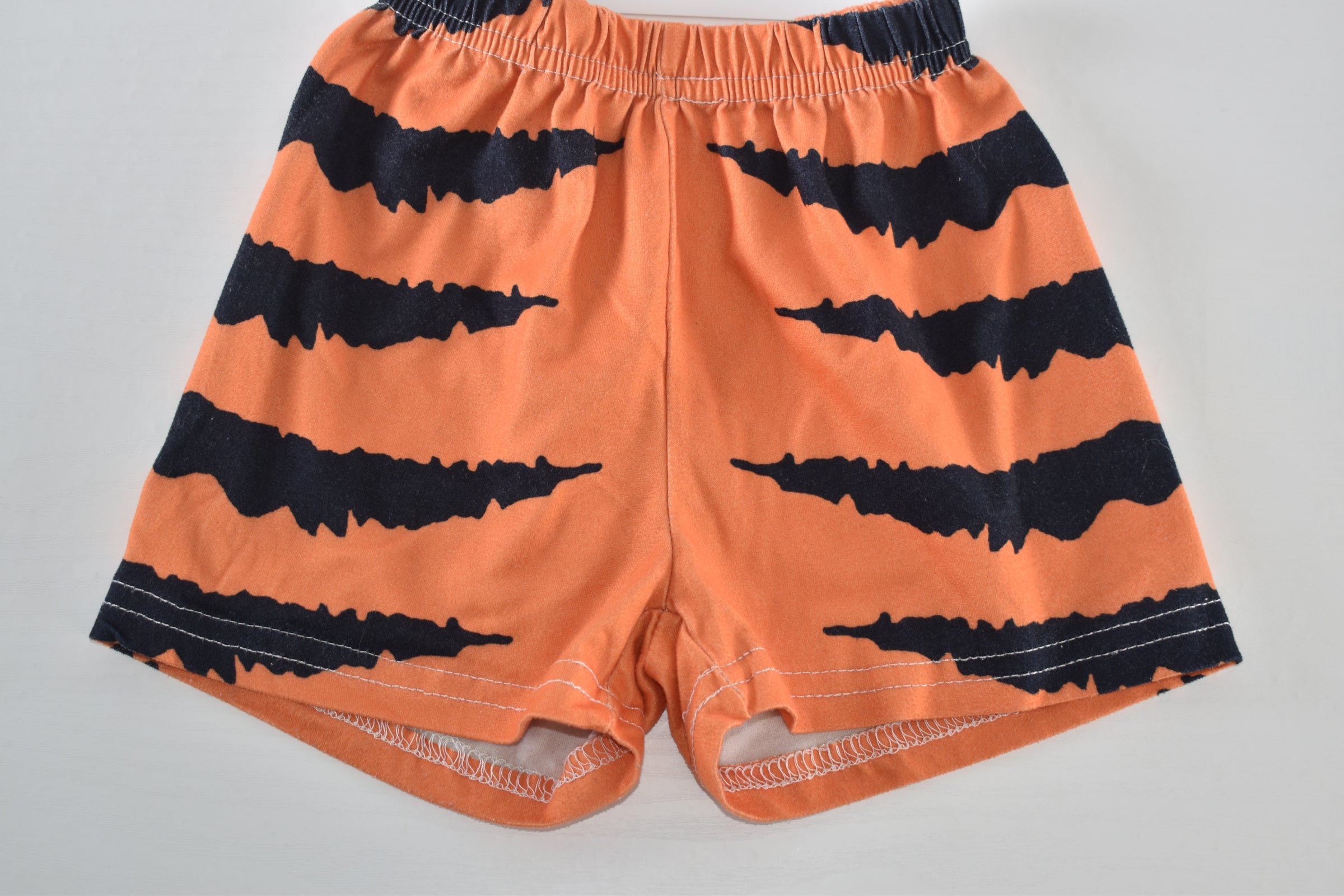 Halloween orange and black spooky stripe shorts