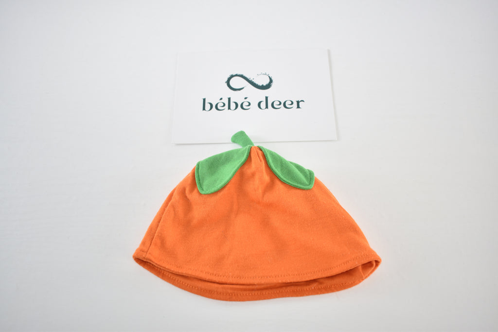 Pumpkin baby hat with green leaf detail