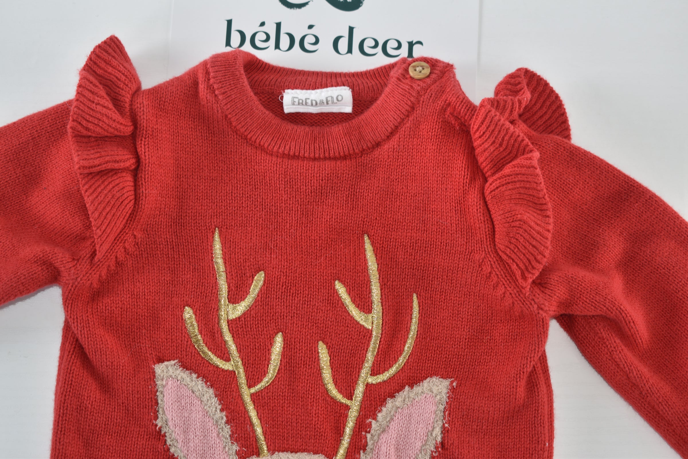 Christmas reindeer knitted jumper with ruffle shoulders