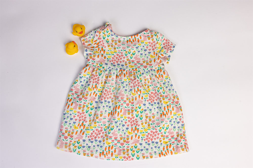 Dress with rabbit, carrot, and flower patterns