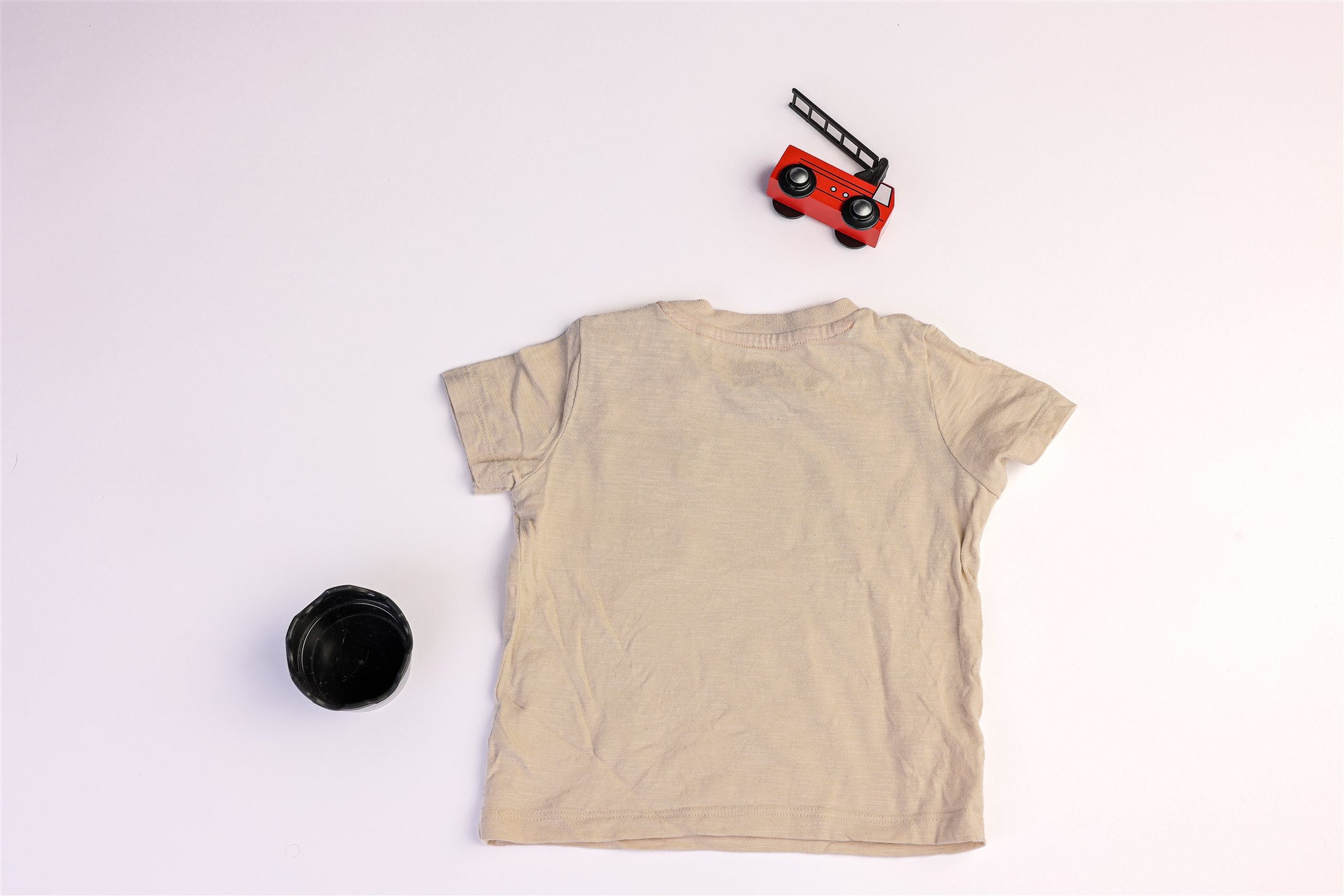 Beige top with a small black pocket