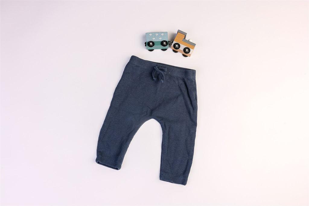 Blue trousers with decorative drawstring