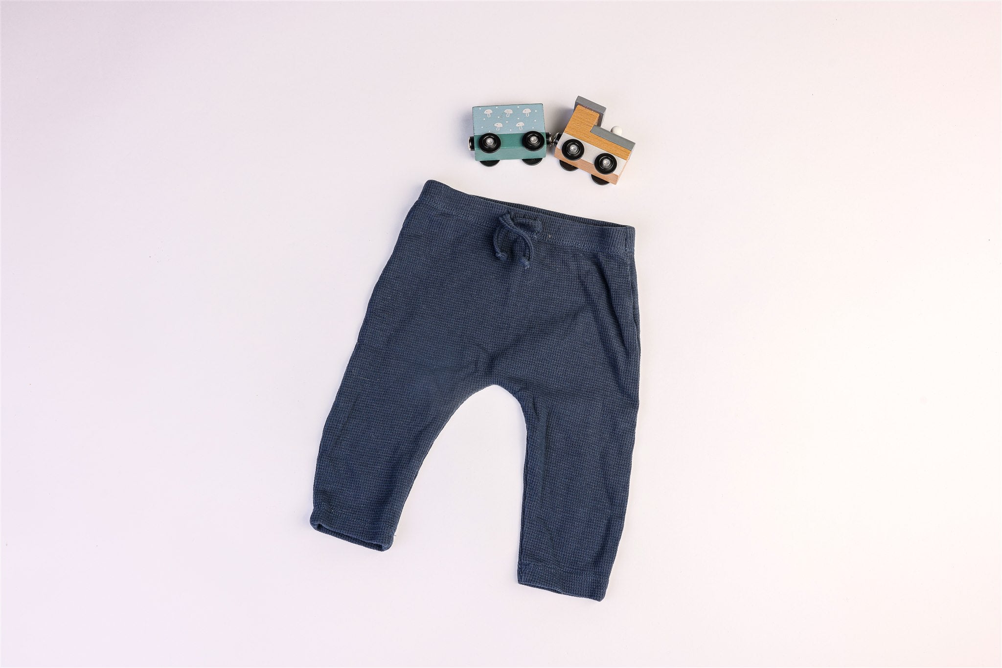 Blue trousers with decorative drawstring