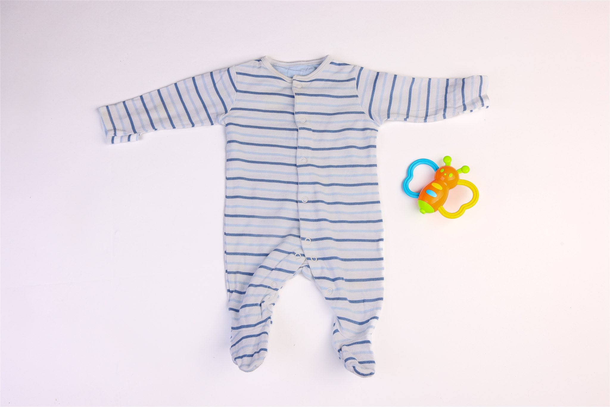 White sleepsuitwith blue stripes