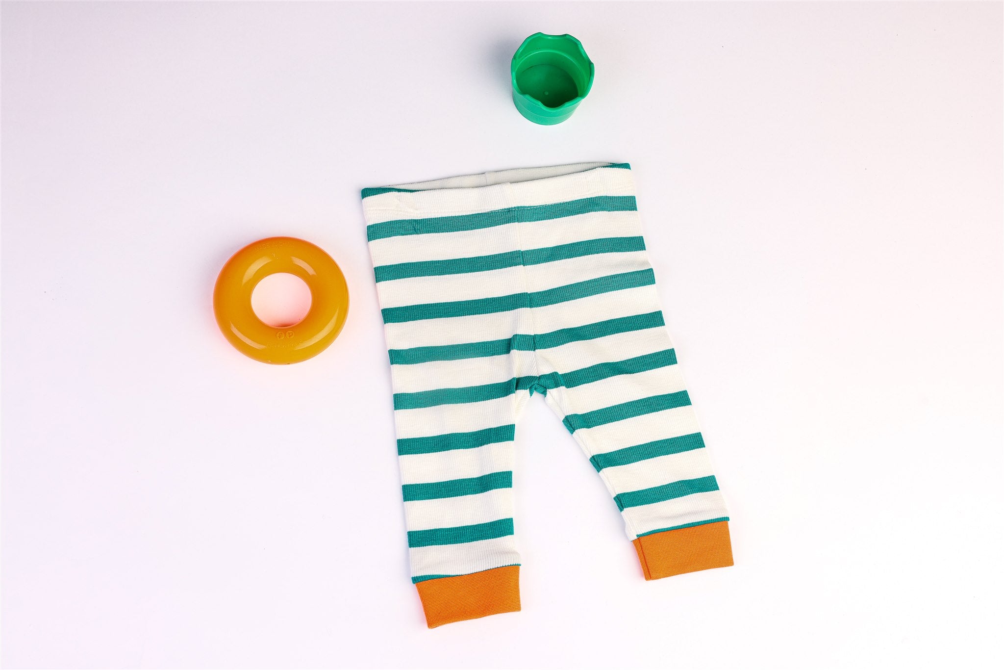 White trousers with green stripes and orange bottoms