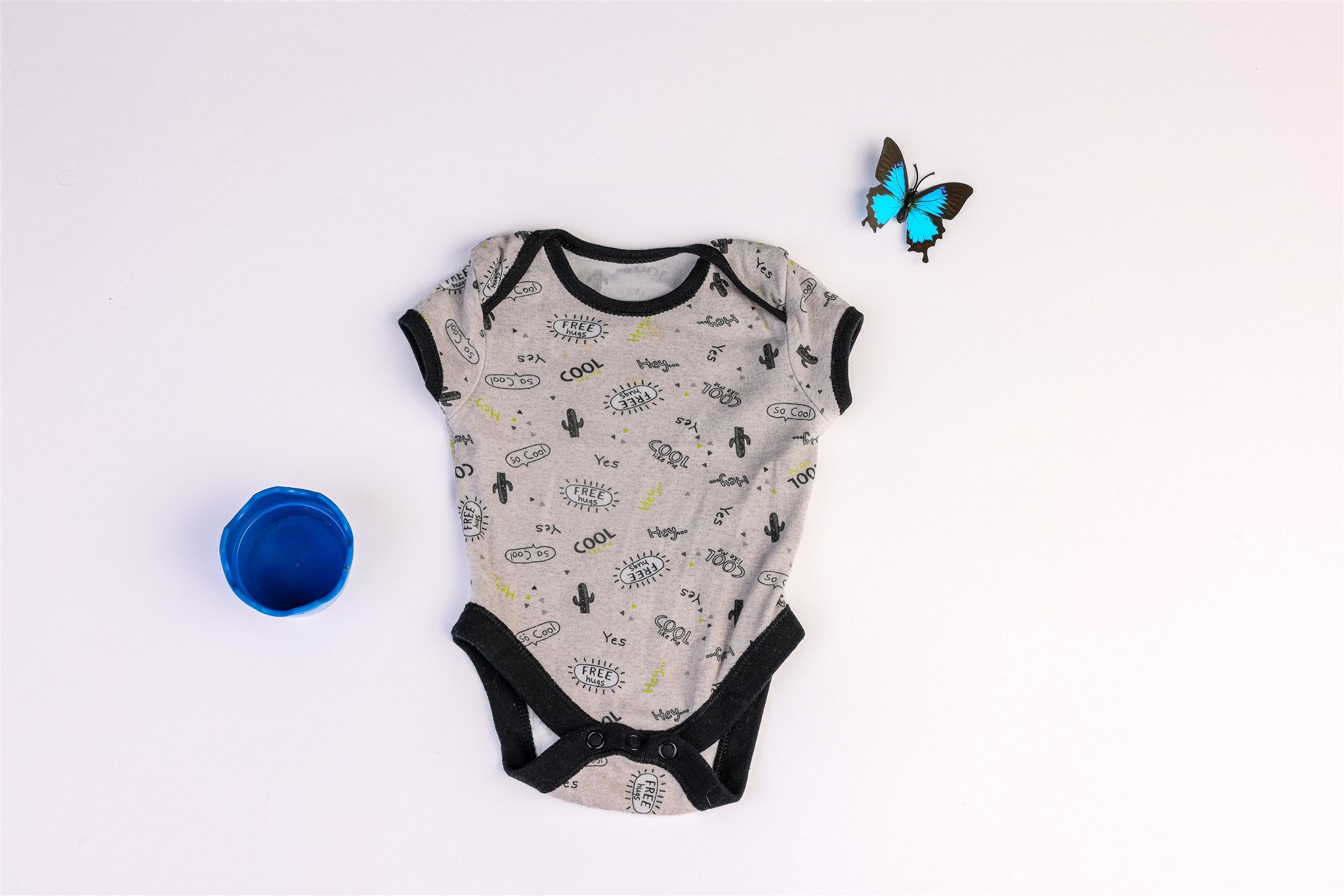 Grey and black bodysuit with cool cactus print and "free hugs"