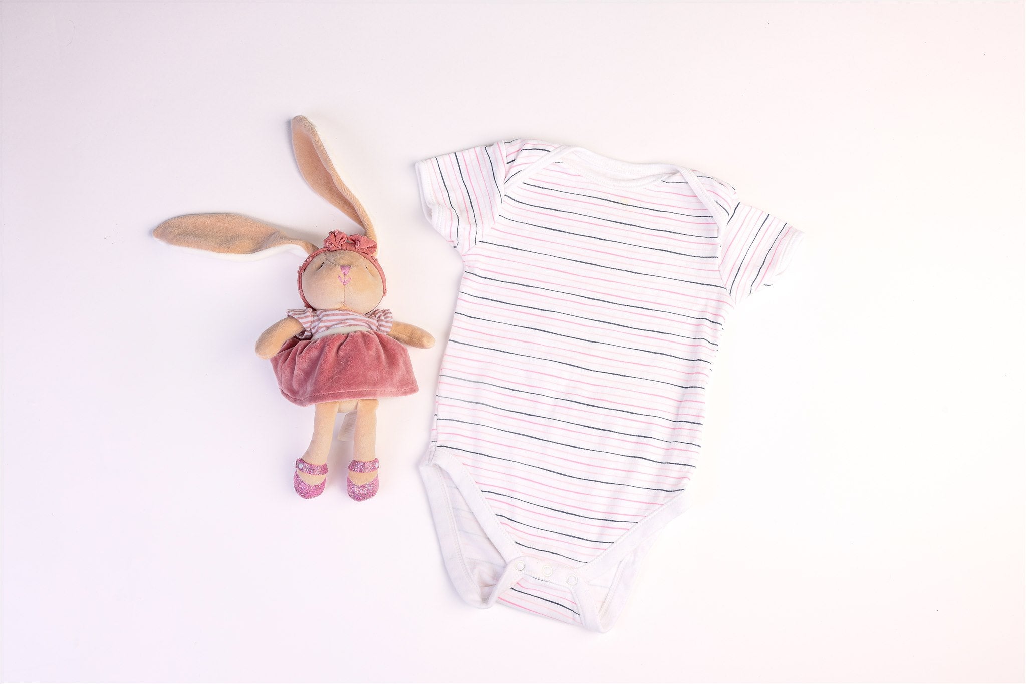 Short-sleeved bodysuit with white, black, and pink stripes